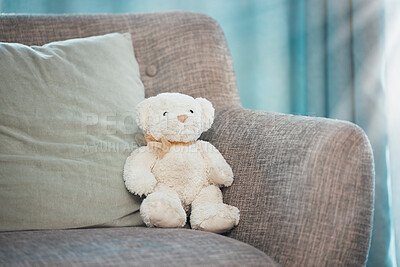 Buy stock photo Lonely, loss and adoption with a teddy bear abandoned on a sofa in an empty living room of a home. Lost, alone and grief with a  stuffed animal sitting on a couch in the lounge of a house alone