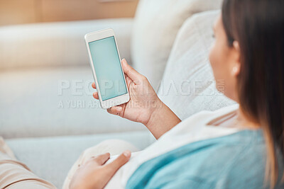 Buy stock photo Pregnant woman, phone green screen and mock up on sofa for marketing, advertising or promotion. Pregnancy, chroma key and female with mobile smartphone for texting, social media or internet browsing.