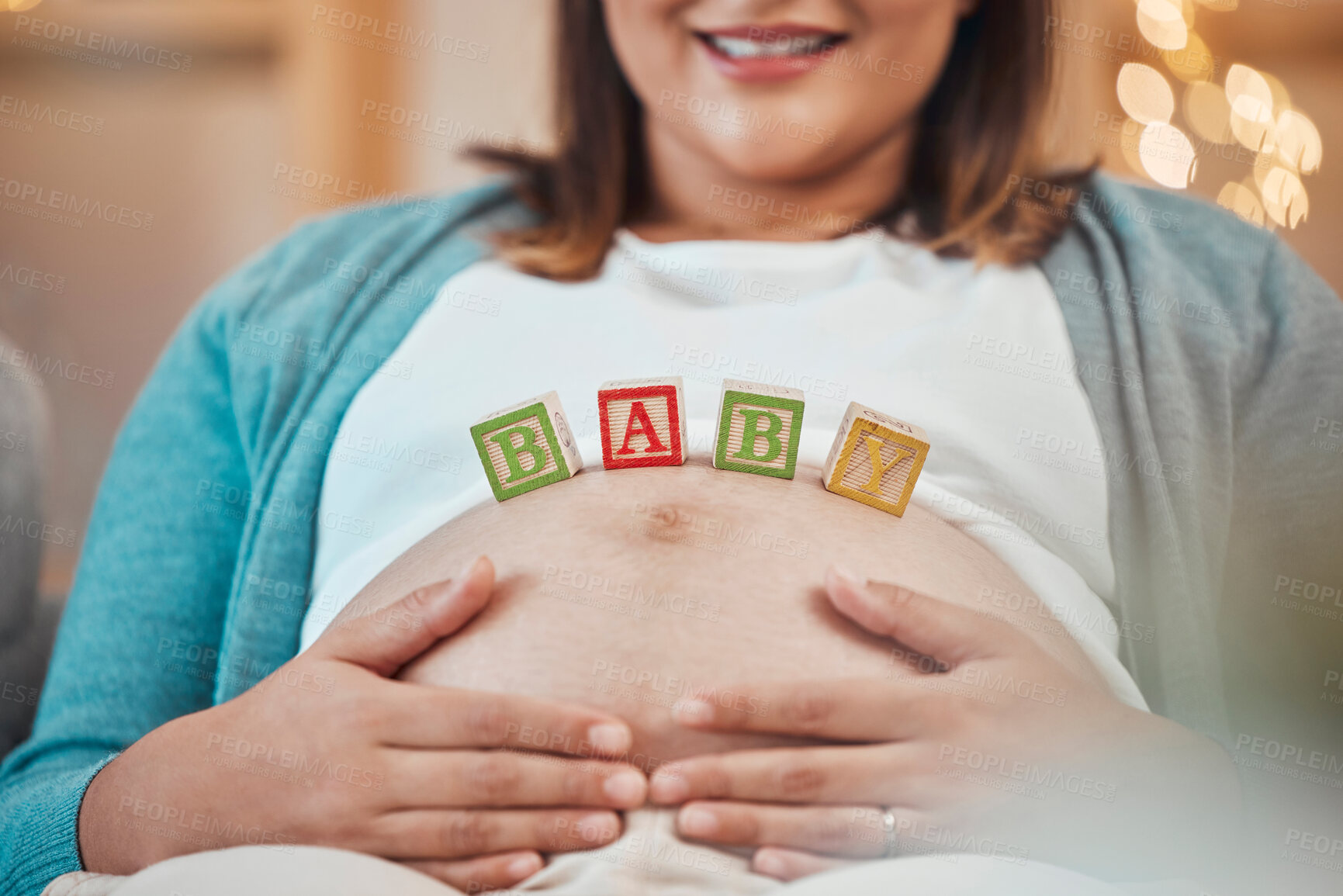 Buy stock photo Pregnant woman, hands and baby letter blocks for maternity, love and care holding tummy for soothing at home. Happy female smile touching stomach in pregnancy, mother to be or support for motherhood