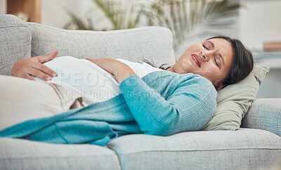 Buy stock photo Pregnancy, cramps and woman with stomach pain on sofa holding abdomen in pain, discomfort and physical strain. Healthcare, baby and pregnant woman rest on couch suffering from maternity contractions