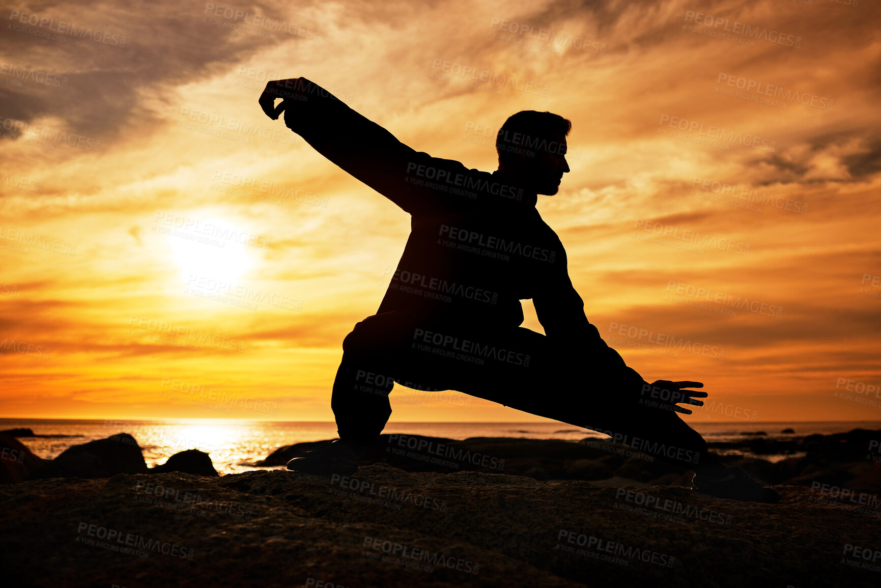 Buy stock photo Karate man, silhouette and tai chi with sunset sky on beach horizon for martial arts, taekwondo or fight exercise, training or practice. Art deco of athlete at sea for nature workout and fitness