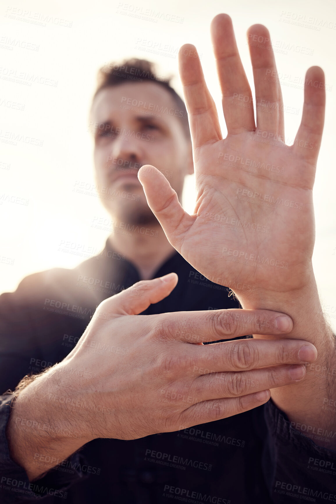 Buy stock photo Man, hands and tai chi pose outdoor while training for health, wellness or fitness. Karate sports, martial arts or male athlete practicing fighting technique outside for workout, practice or exercise