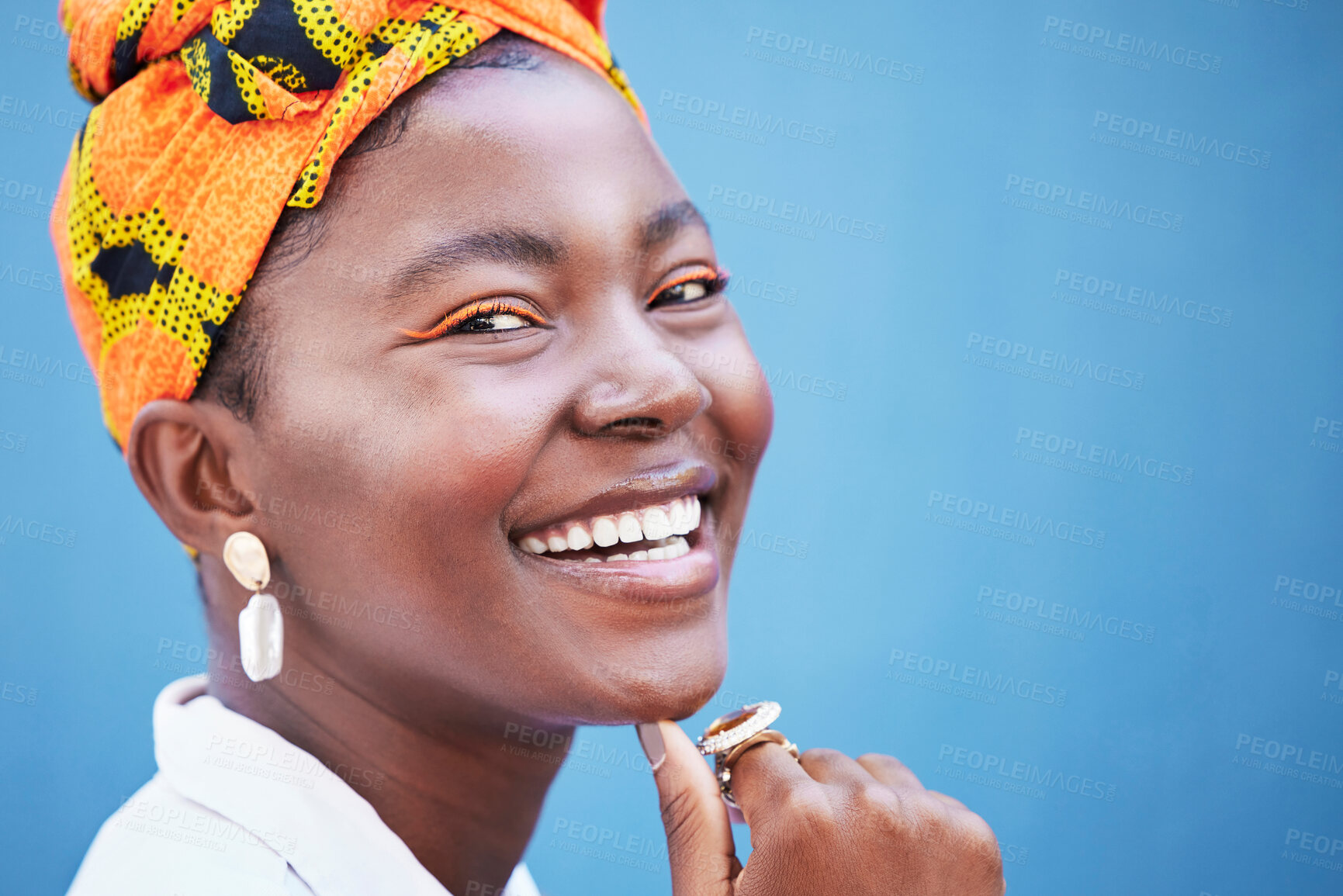 Buy stock photo Portrait, black woman and smile with head wrap, natural beauty or confidence for cosmetics on blue studio background. Jamaican female, girl or young lady with traditional headscarf, stylish or makeup