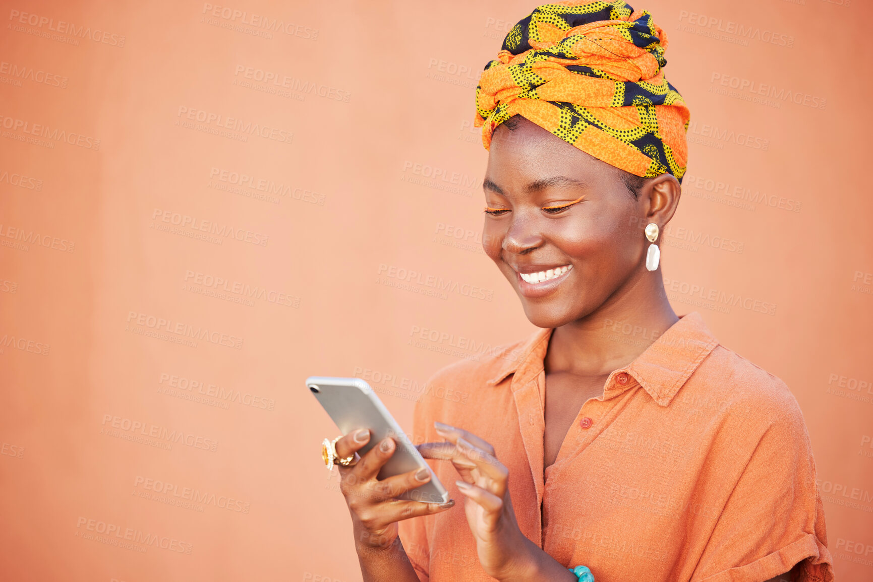 Buy stock photo Black woman, head scarf and smartphone for connection, communication and reading online on studio background. Jamaican lady, phone and girl smile with traditional head wrap, marketing and mockup.