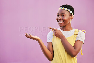 Buy stock photo Face portrait, black woman and pointing at mock up for marketing, advertising or promotion on a studio background. Product placement, branding and happy female model from Nigeria showing copy space.
