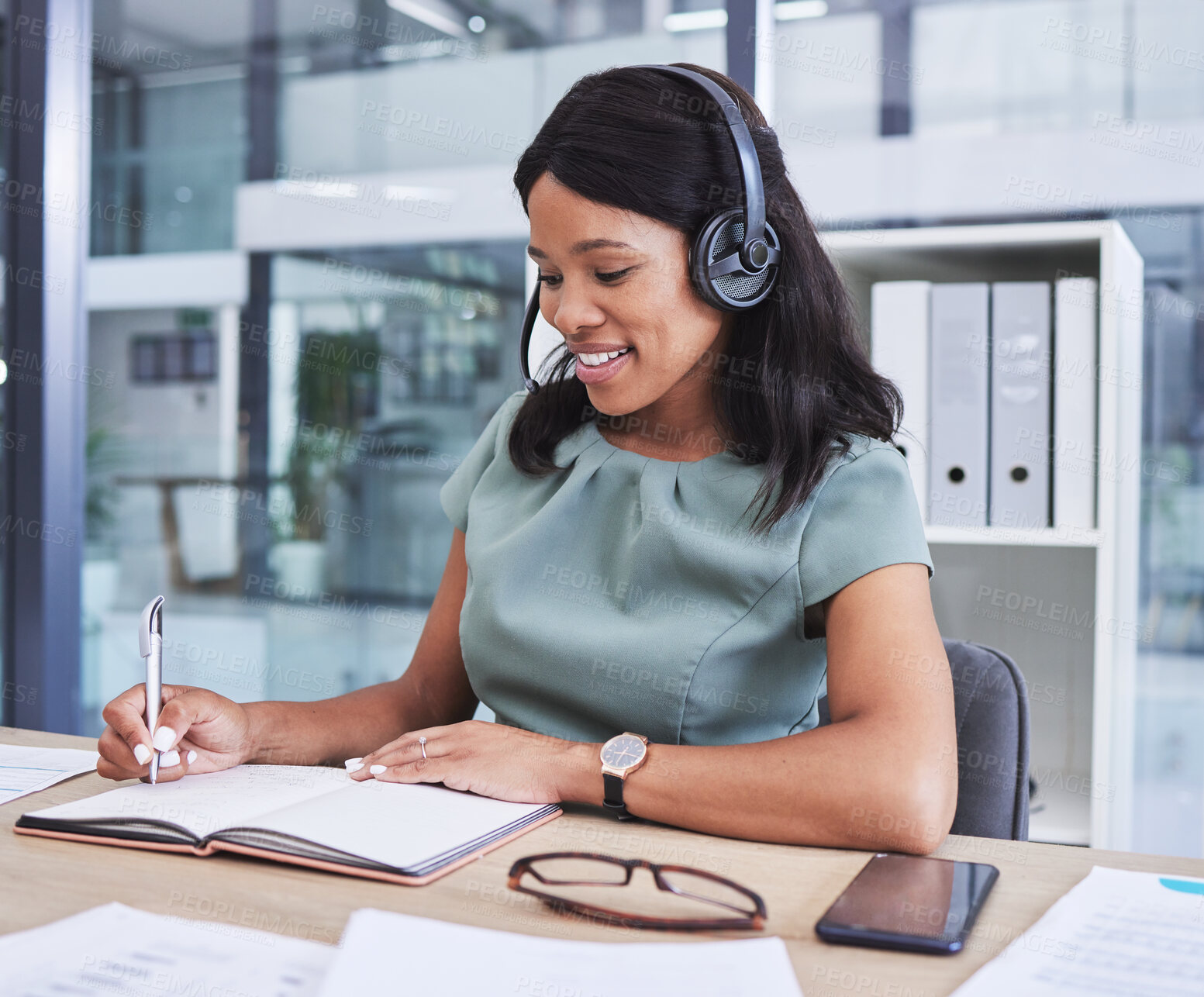 Buy stock photo Headphones, notebook and writing with business woman for research, consulting and conference. Data, administration and information with black woman in office for knowledge, planning and idea