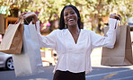 Retail, shopping bags and portrait of black woman in city for discount, spree and expensive purchase. Luxury, products and fashion with customer in streets for sales promotion, boutique and spending