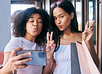 Selfie, peace and shopping with black woman friends posing for a phone photograph outdoor in the city together. Mobile, hand sign and pout with a female customer and friend in a mall or retail store