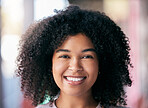 Face of happy black woman and relax while shopping for Christmas presents in South Africa with a blurred background. Portrait of professional girl, young African American with a smile and afro hair 
