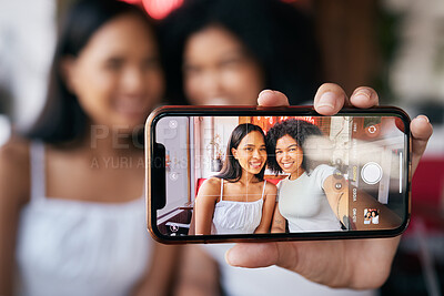 Buy stock photo Woman friends, selfie and phone screen for social media, blog post or bonding in restaurant. Happy black woman, influencer group and smartphone picture for social network, app or internet with smile
