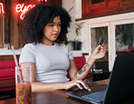 Woman, laptop and credit card for banking payment in a cafe or restaurant with fintech. Pc, coffee shop and female paying for ecommerce online shopping order while buying with a debit card