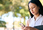 Phone, park and mockup with a business black woman outdoor in summer for communication or networking. Mobile, social media and 5g with a female employee typing a text message in a garden outside