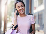 Phone call, travel or black woman with shopping bags in Paris street, city or road for communication, networking or talking outdoor. Happy, smile or girl traveling with smartphone for comic news

