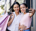 Phone selfie, shopping and friends, woman with smile and fashion sale bag on shoulder with friend. Friendship, happiness and women from Brazil taking picture with smartphone and shopping bag at mall.