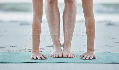 Buy stock photo Feet, yoga and beach stretching for health and wellness, fitness and strength in nature. Seaside, sand and yoga mat for flexible yogi stretching or pilates training by the coast for healthy sport