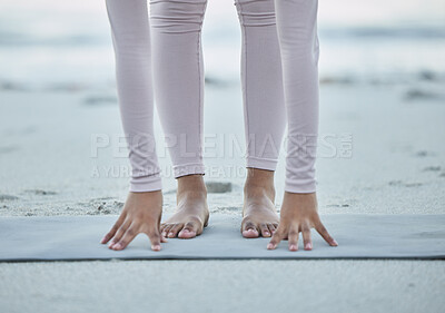 Buy stock photo Fitness, yoga and legs of woman at the beach for stretching, exercise and pilates training in nature. Mindfulness, motivation and hands and feet of girl for workout, balance and performance by ocean