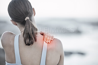 Buy stock photo Back, pain and injury with a sports woman holding her shoulder during an exercise workout on the beach. Fitness, health and wellness with a digital CGI or overlay on a female hand outdoor in nature