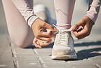 Ready, fitness and feet of a woman in the street for a race, marathon or cardio running in city of Sweden. Exercise start, health shoes and athlete laces for training motivation, sports and workout