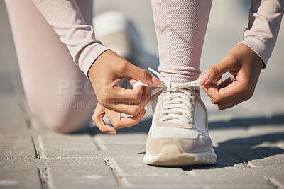 Buy stock photo Ready, fitness and tie shoes of a woman in the street for a race, marathon or cardio running in city of Sweden. Exercise start, health and athlete laces for training motivation, sports and workout
