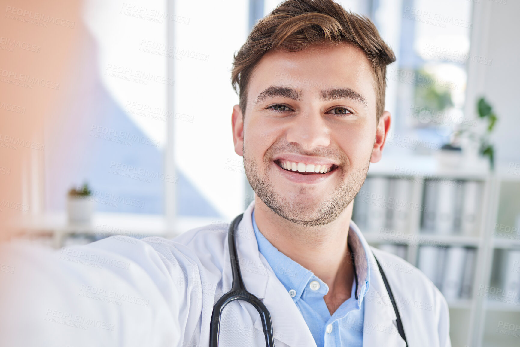 Buy stock photo Happy, portrait or doctor taking a selfie for a social media profile picture in a healthcare hospital on a break. Relaxing, man or face of medical worker taking pictures with pride or smile in office