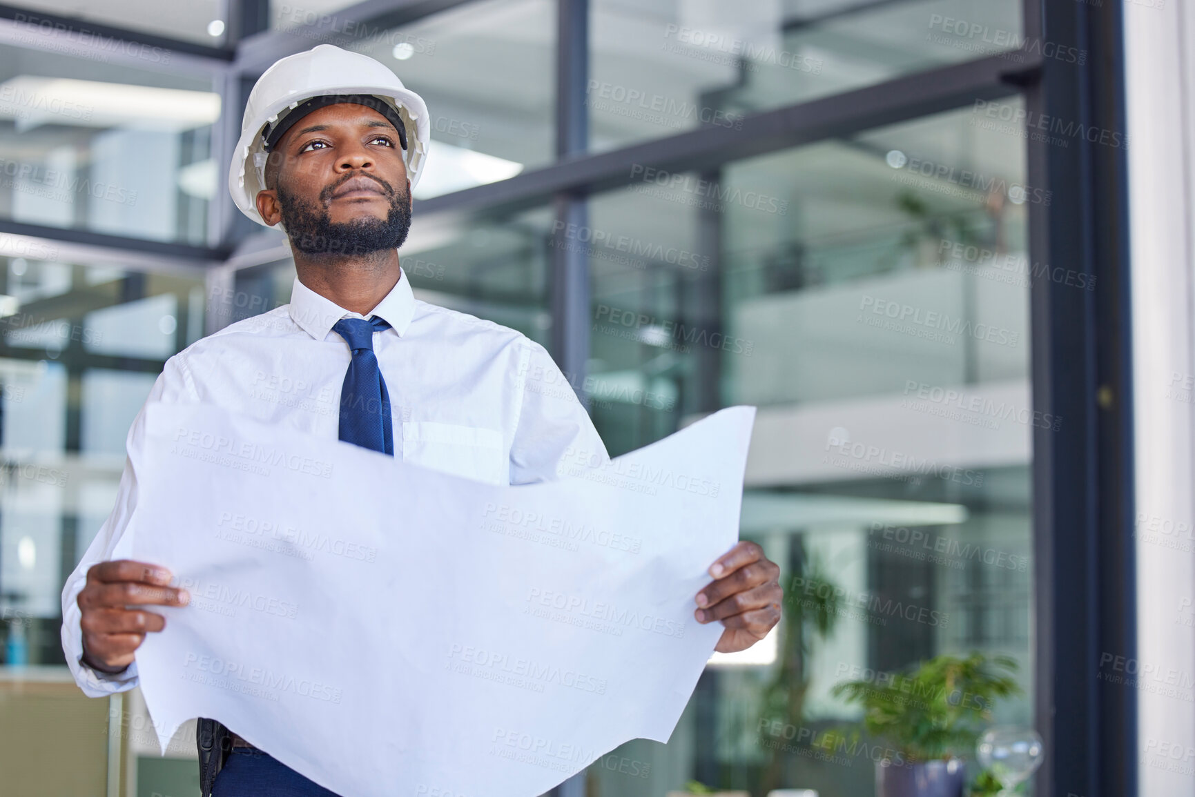 Buy stock photo Black man, architect and blueprint in construction planning, thinking or contractor at the office. African American male engineer holding project plan for industrial building, layout and architecture