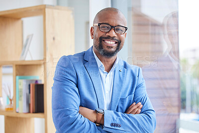 Buy stock photo Motivation, vision and mindset with a business black man CEO, manager or boss standing arms crossed in the office. Portrait, glasses and mission with a mature male employee leaning against a window