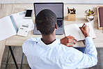 Top view, black man and writing with laptop, planning schedule and online reading in office. Nigerian male, entrepreneur and make notes for marketing strategy, search internet and ideas for business.