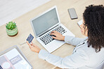 Top view, laptop and business woman with credit card for online shopping, payment or banking. Mock up, ecommerce and fintech with female employee on computer with debit card for transaction in office