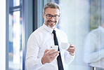 Phone, coffee and happy businessman in office scrolling on social media, mobile app or the internet. Technology, professional and male manager, leader or boss reading blog on cellphone in workplace.