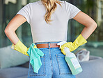 Bacteria, product and spray bottle with woman in living room for hygiene, disinfection or cleaning safety. Germs, dust cloth or chemical with girl cleaner or detergent in home for housekeeper service