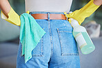 Cleaning service, product and woman hands with bottle, liquid spray solution and cloth for home, hotel or hospitality industry, career or business. Spring cleaning, worker jeans and bacteria cleaner