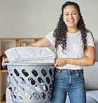 Woman, portrait and laundry basket for cleaning and folding of clothing with happiness at home. Chores, washing and face of happy female with housework for tidy and clean clothes routine