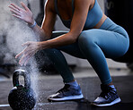 Woman, powder hands and kettlebell exercise, challenge and workout in gym, fitness club and body muscle. Zoom of bodybuilder, chalk and weightlifting, grip and weight training, performance and power