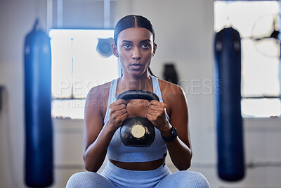 Buy stock photo Kettlebell, fitness and training black woman or workout bodybuilder in a gym studio for muscle wellness, body goals and power. Focus, breathing and a strong sports athlete with training gear exercise
