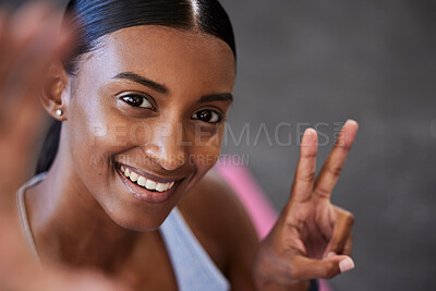 Buy stock photo Woman, selfie and peace sign in gym after workout, exercise or training. Portrait, fitness and female athlete from India take photo with hand gesture for happy memory, profile picture or social media