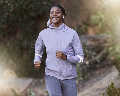 Buy stock photo Black woman, running and outdoor for exercise, training or fitness for health, wellness or smile. Jamaican female, healthy athlete or runner in nature, workout or practice for power, energy or cardio