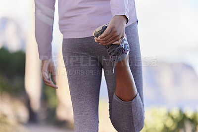 Buy stock photo Stretching, running and shoes of black woman in nature for training, fitness or cardio endurance. Stamina, jogging and workout with girl runner and warm up on mountain path for exercise performance