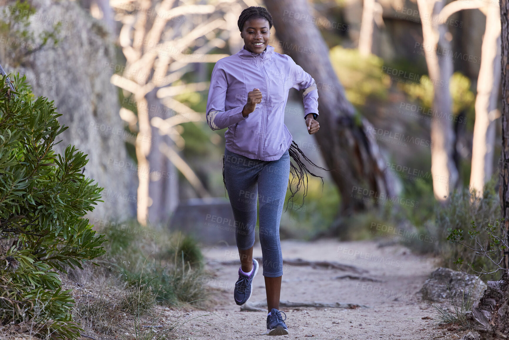Buy stock photo Fitness, nature and black woman running for exercise with endurance, focus and health in a forest. Sports, athlete and African lady doing cardio workout or training for race, marathon or competition.