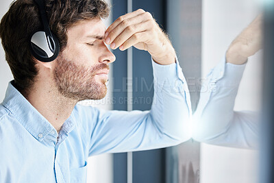 Buy stock photo Headache, stress and call center man in office feeling exhausted, tired or fatigue. Crm, customer service and male telemarketing consultant with depression, anxiety and burnout in company workplace.