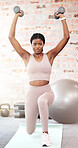 Black woman, dumbbell exercise and lunge in gym of exercise, training or strong body in Nigeria fitness club. Portrait, young female and lifting weights with balance, muscle power and wellness energy