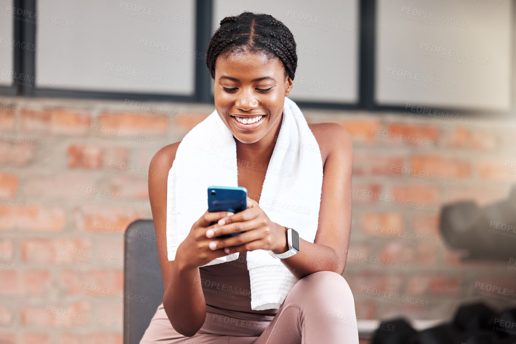 Buy stock photo Black woman, smartphone and exercise in gym, connection and social media. Jamaican female, athlete and phone for communication, relax and break after fitness, workout and training for health or smile