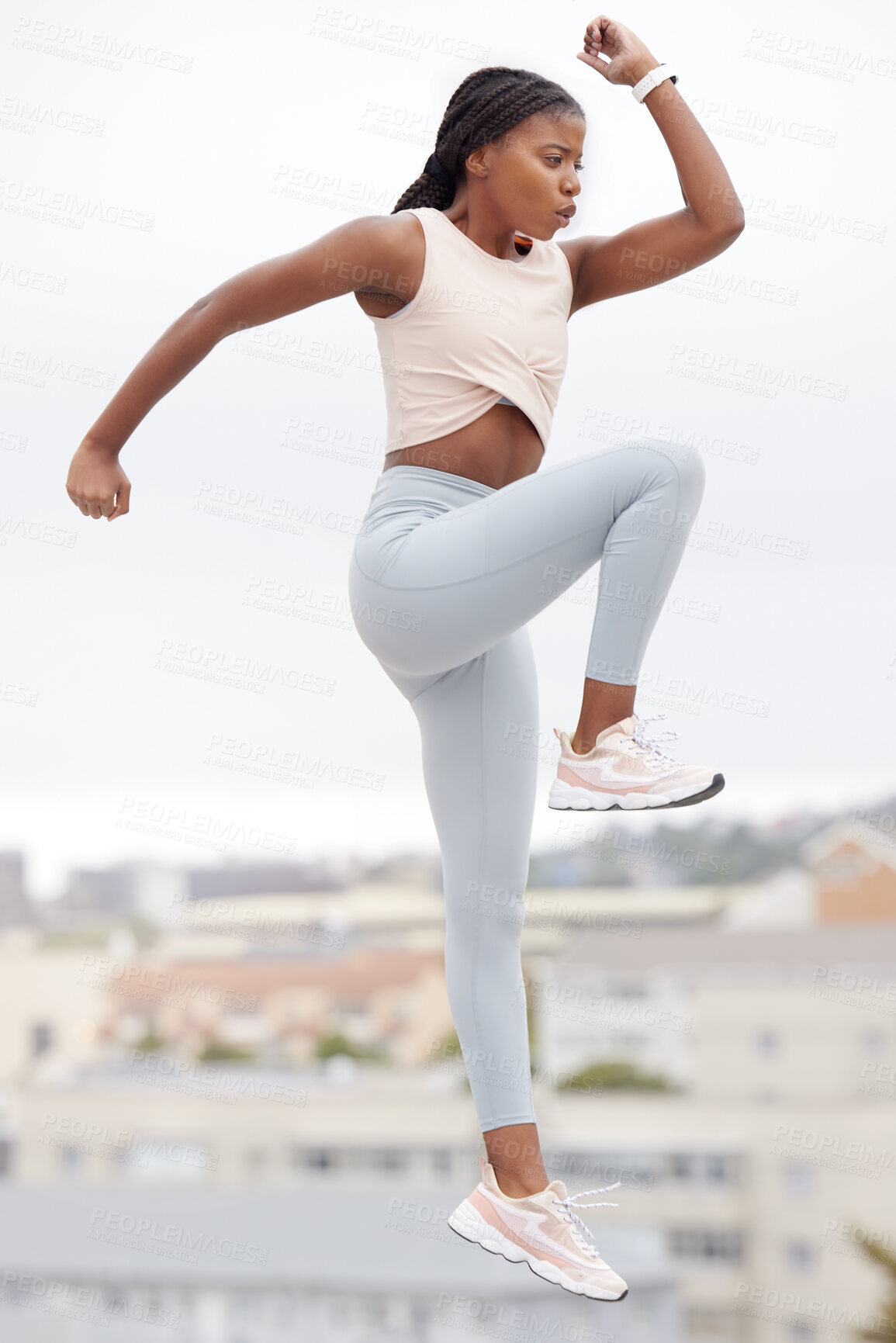 Buy stock photo Black woman, jump and fitness while workout, exercise and training in Brazil, city and body warm up for health and wellness. Young female athlete, jumping and cardio practice outdoor in a urban town