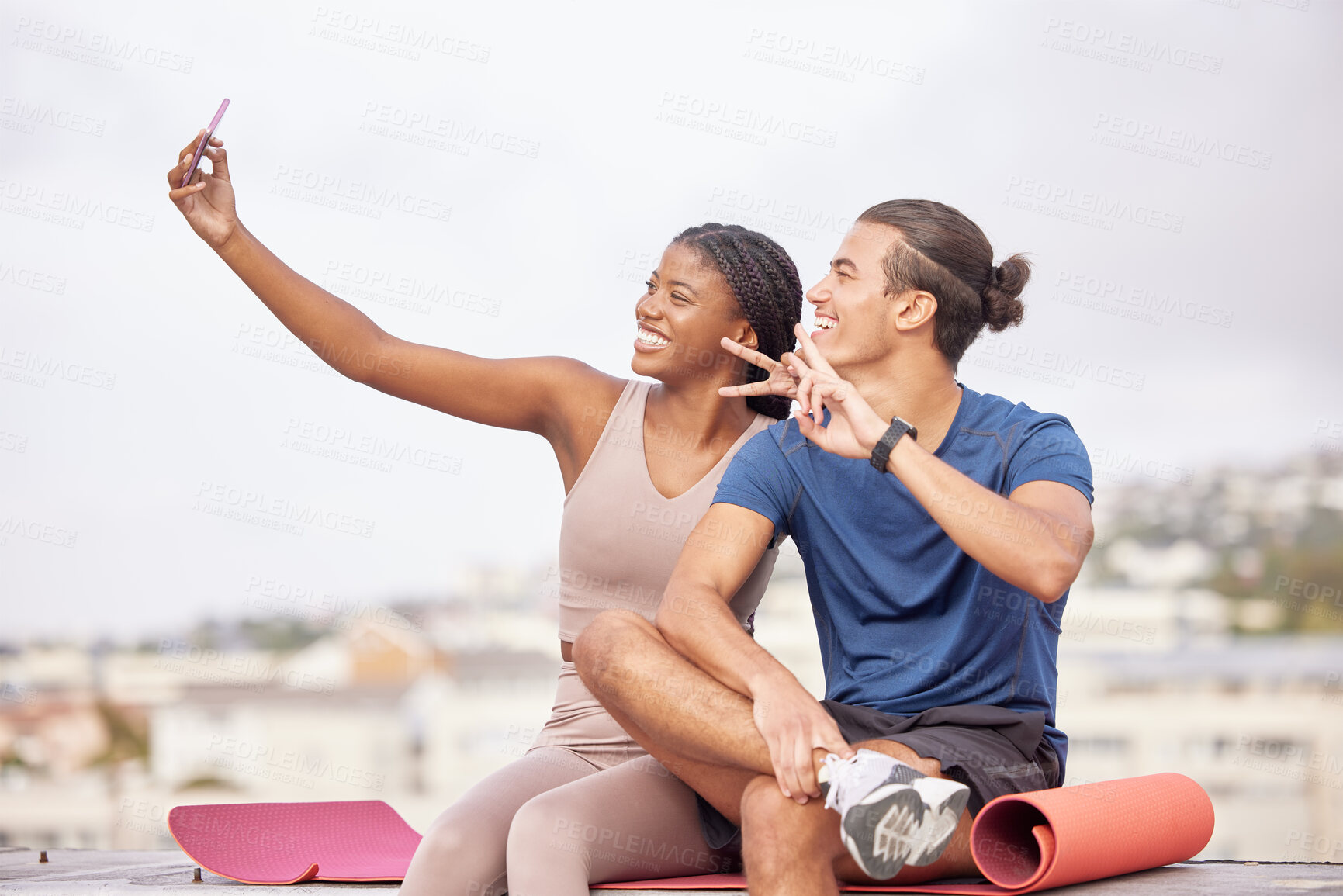 Buy stock photo Couple, fitness and selfie with a peace sign after exercise for a social media post or blog update while outdoor in city with a smile and support. Man and black woman together for a workout in France