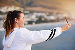 Beach selfie, happy and woman with a phone for video call, communication and social media update on holiday in Bali. Travel influencer, smile and girl with mobile photo on an ocean vacation in summer