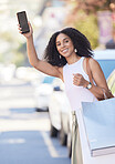 Black woman, shopping and phone waiting for transport, pickup or travel on the street in an urban town. Portrait of happy African American female shopper in city traveling, bags and mobile smartphone