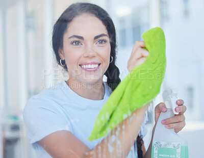 Buy stock photo Happy, woman and cleaning home window with cloth and detergent product to polish glass. Spring cleaning, hygiene and clean habit of girl at apartment with chemical spray in Florida, USA.

