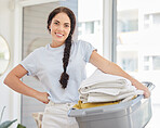 Woman, laundry basket and home portrait in lounge, room and cleaning for service, chores and smile. Happy cleaner, clothes or clean fabric for hygiene, care or job in house, apartment or living room