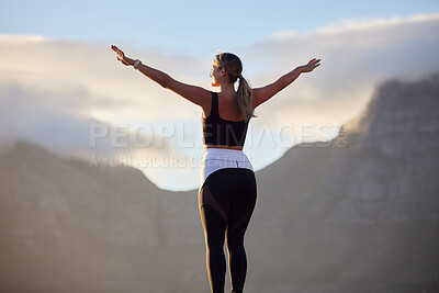 Buy stock photo Freedom, fitness and woman in nature by mountain spreading hands wide open. Open arms, peace and female relax outdoors on break enjoying view after running, exercise or training, hike or workout.