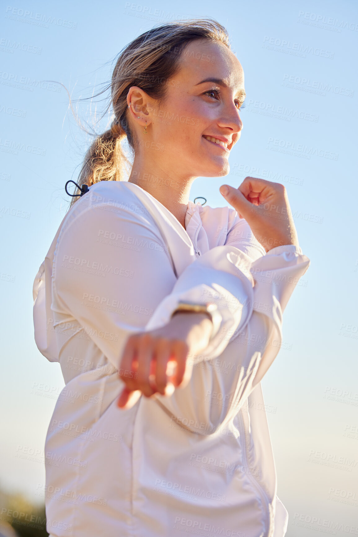 Buy stock photo Fitness, woman and runner stretching arms for exercise, workout and outdoor training in sunshine, morning and with motivation. Happy girl, healthy lifestyle and body warm up for  wellness with energy