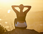 Relax, sunset and fitness woman on a mountain rock looking at nature view for calm yoga. Workout, zen and back of a pilates athlete with peace, meditation and chakra wellness training outdoor